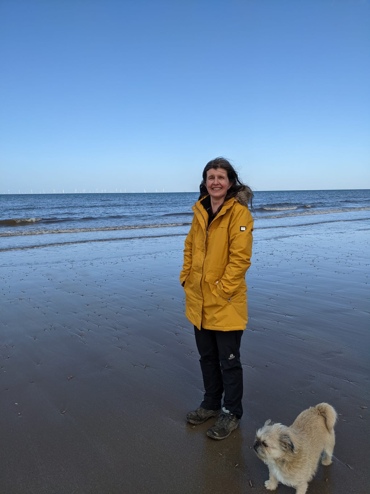 Diane, who runs writing workshops in and around Abergele, Conwy, and around Denbighshire, and Flintshire, and wrote The Little Yellow Boat, seen here on Pensarn beach with her dog, Renly