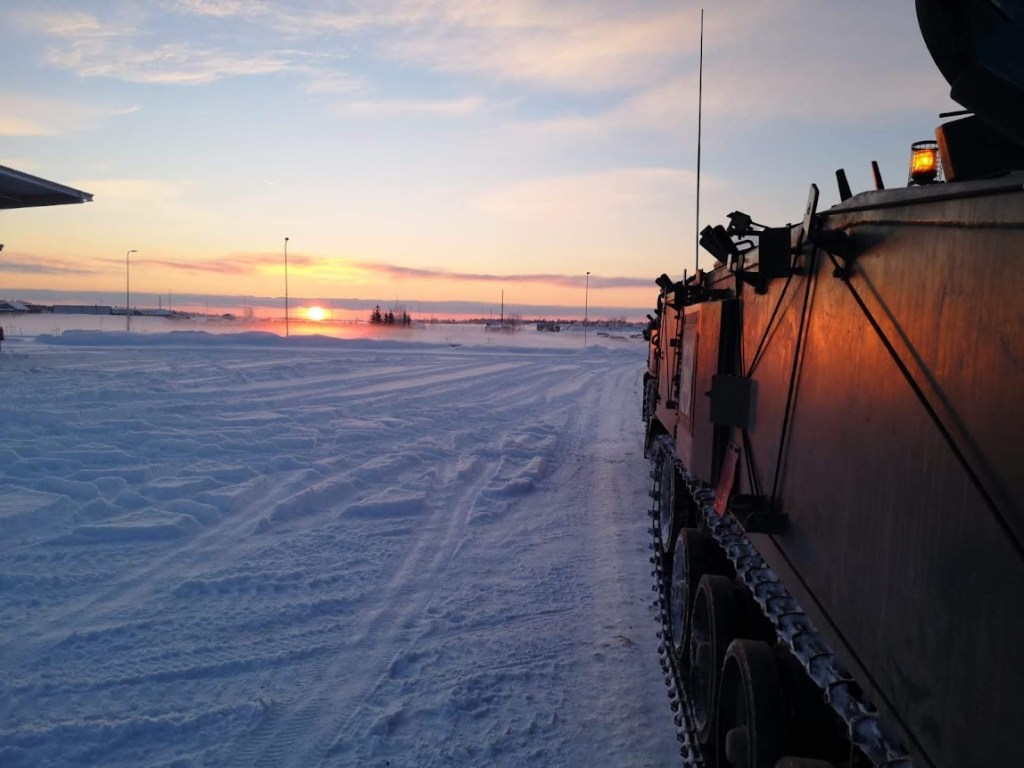 Sunrise over snow taken from a tank by Diane Woodrow's son Ben